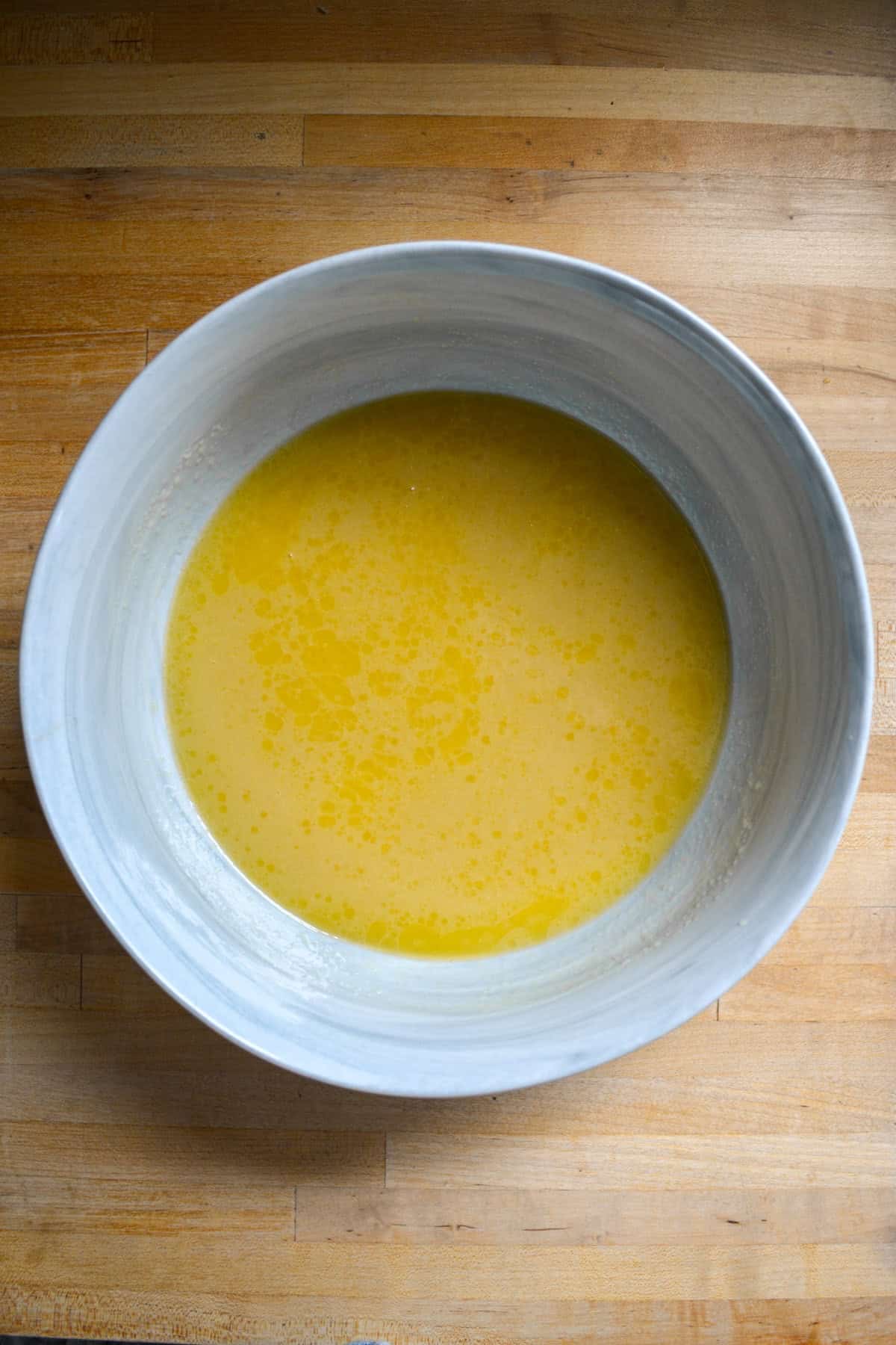 Wet ingredients for the muffins in a large mixing bowl.