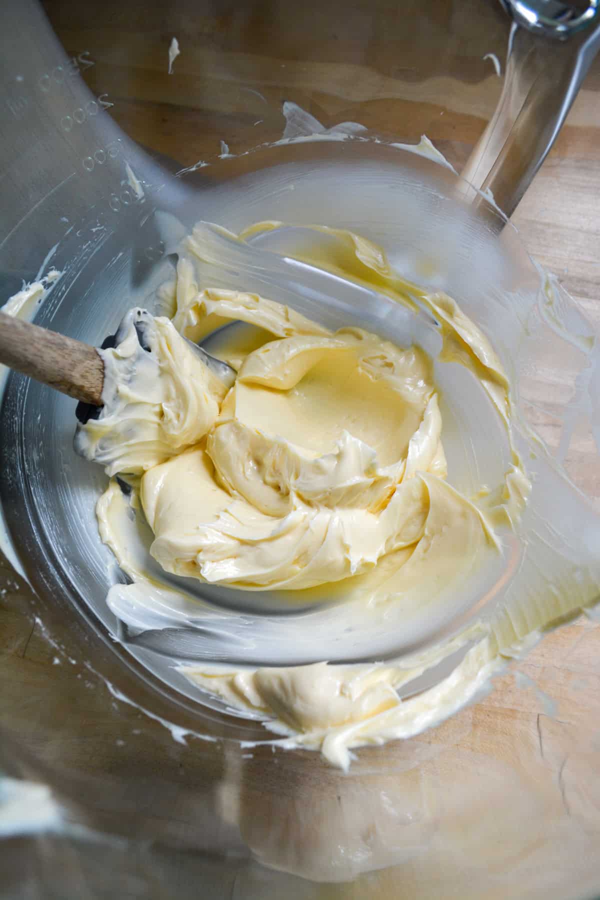 Vegan butter mixed until creamy in a glass bowl.