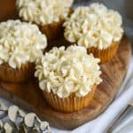 Vegan vanilla frosting piped onto cupcakes.