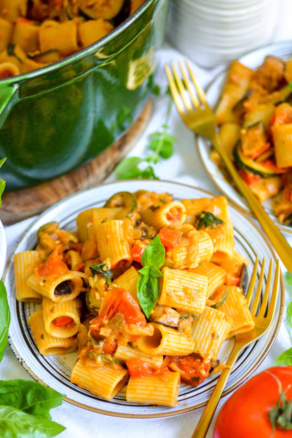 Creamy Roasted Vegetable Pasta on a plate topped with fresh basil.