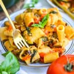 A fork with a bite of Creamy Roasted Vegetable Pasta on it.
