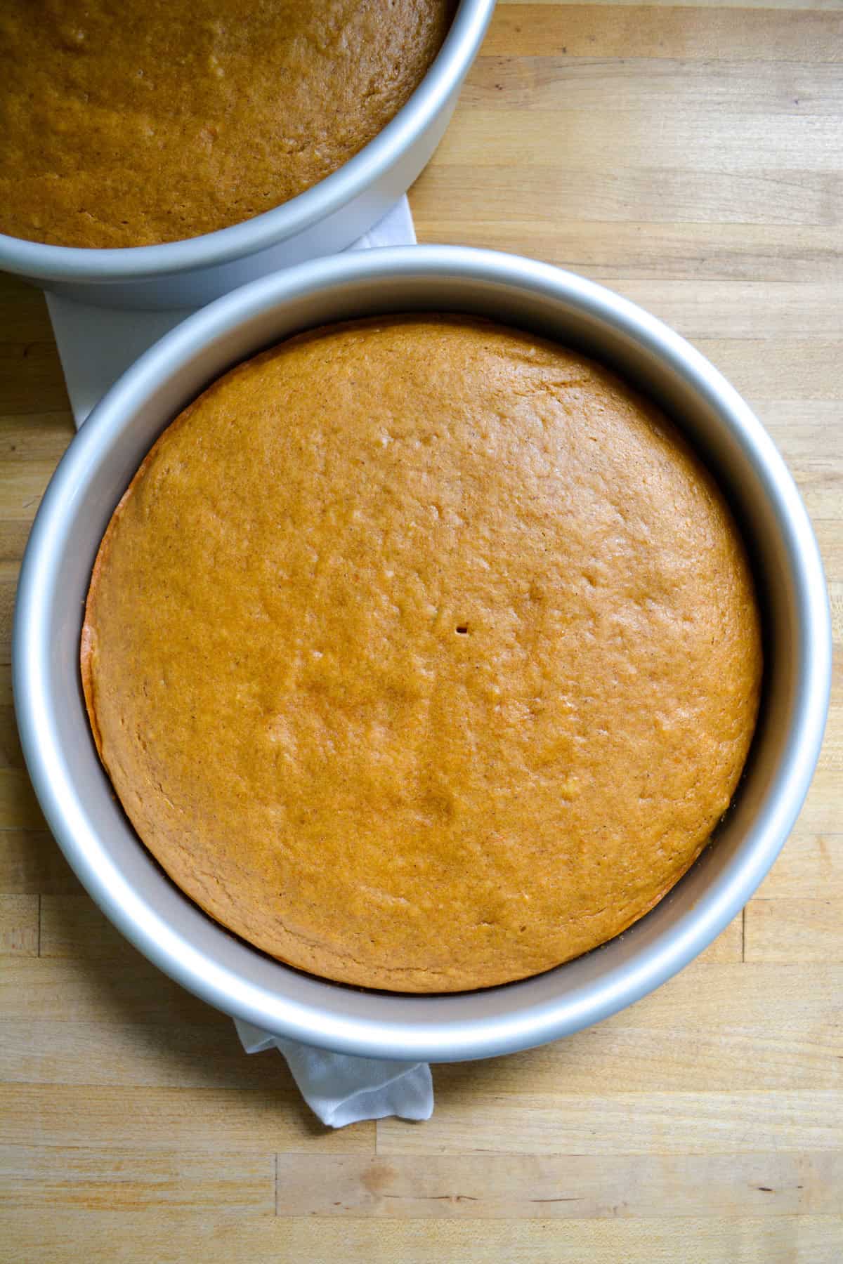 Bake vegan pumpkin cakes in round cake pans.