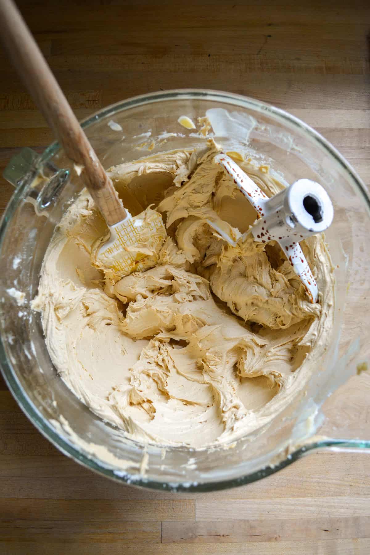 Brown sugar frosting in a glass bowl.