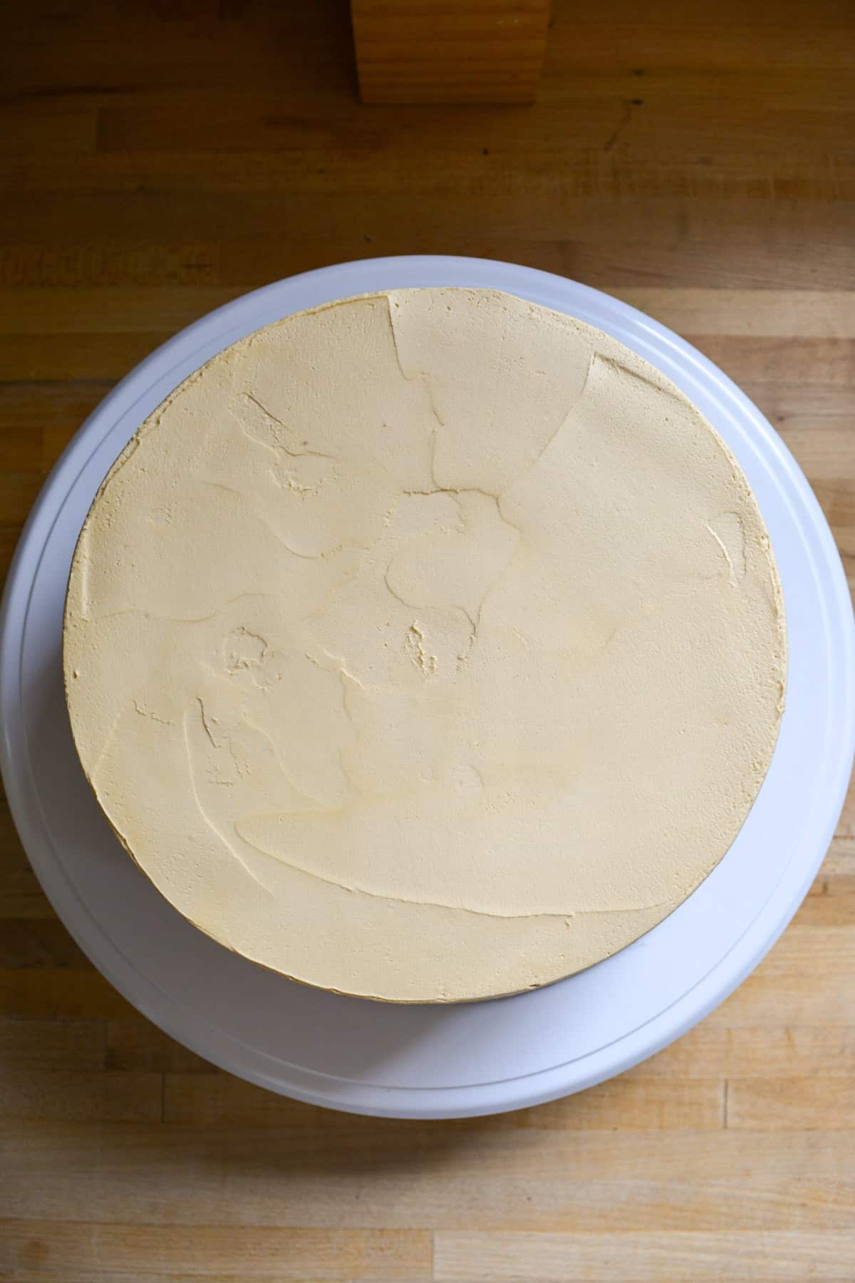Frosted Vegan Pumpkin Cake ready for decorating.