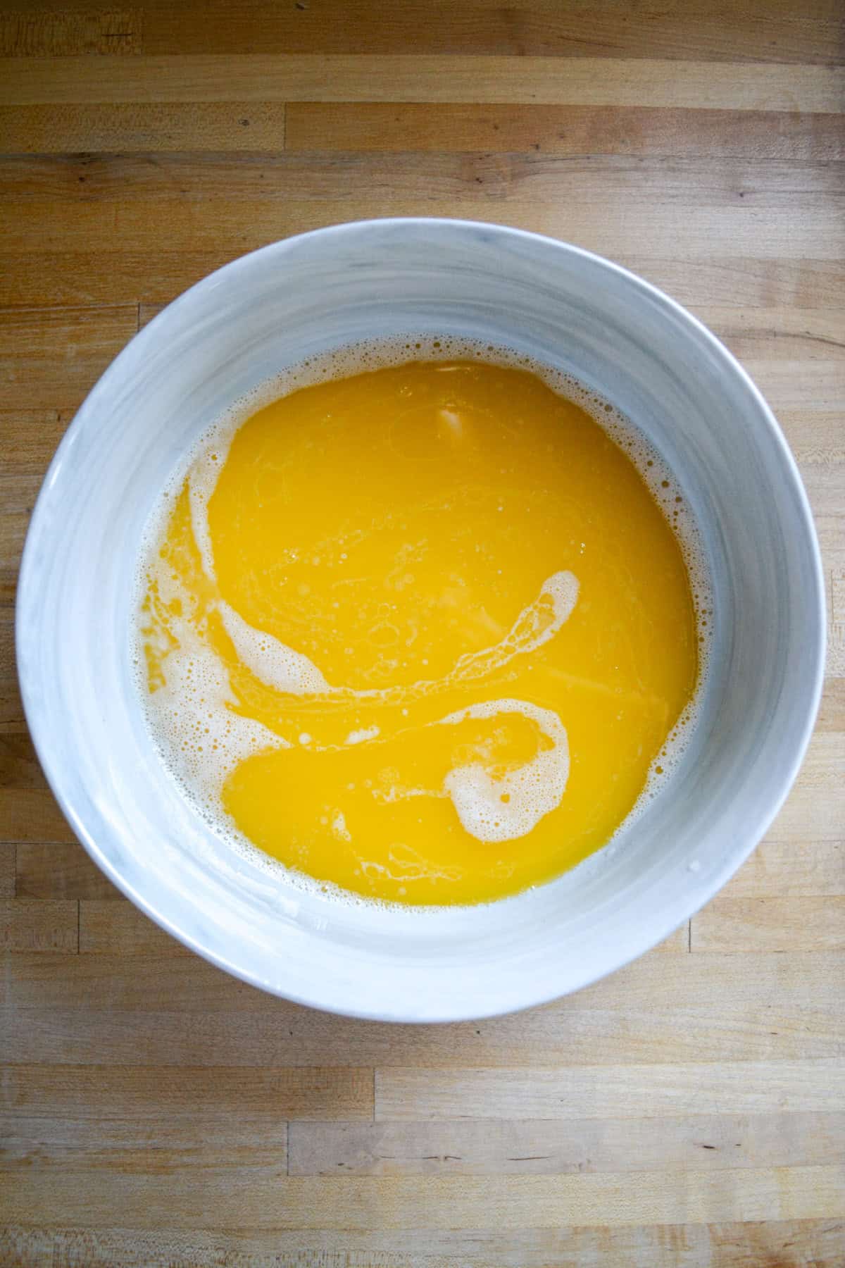 Wet ingredients for the cake in a large mixing bowl.
