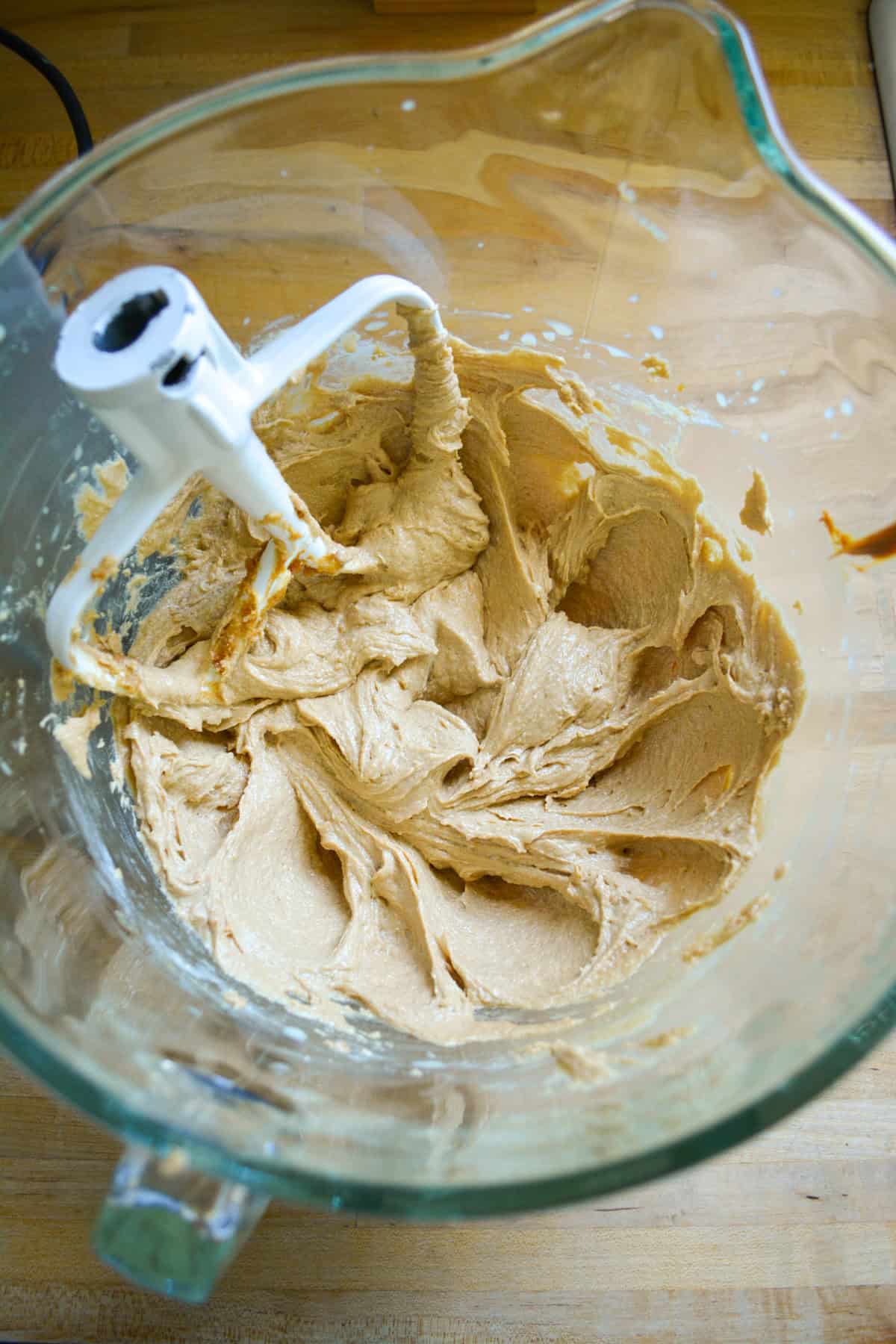 Creamed mixture in a glass mixing bowl.