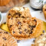 An Oat Flour Chocolate Chip Muffin brown in half to show the fluffy interior.