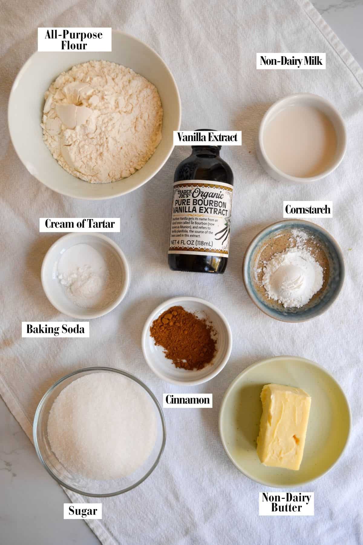 Ingredients for this recipe in small bowls on a linen surface.